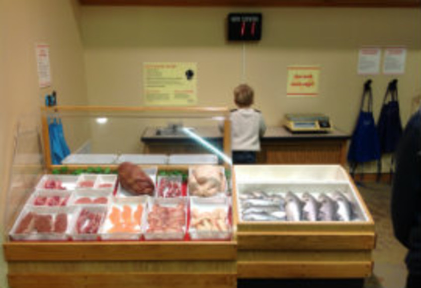 A trainee fishmonger at work