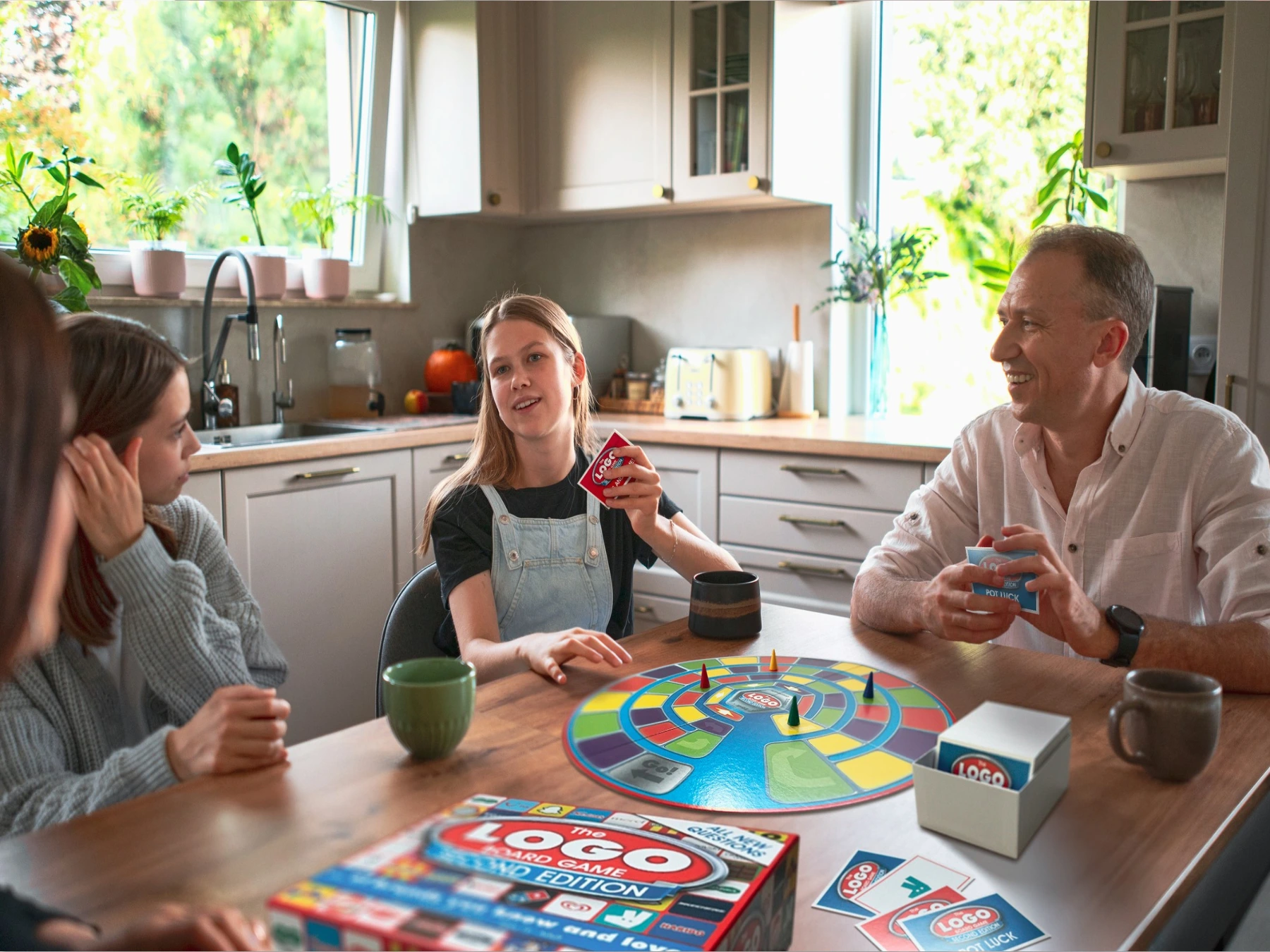 Family playing Logo Second Edition