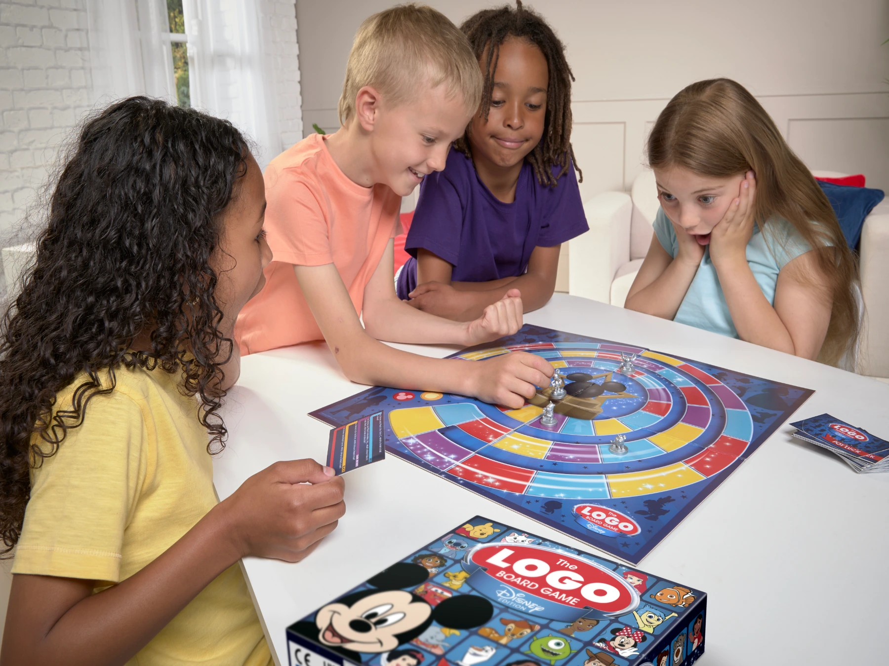 Four children playing LOGO Disney